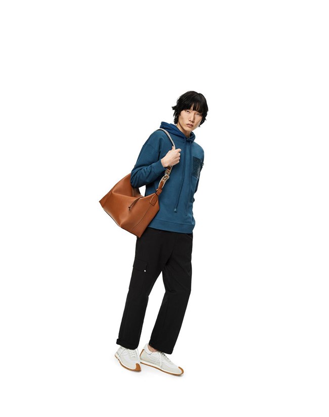 Loewe Anagram leather patch hoodie in cotton Petroleum | CRHUB-6712